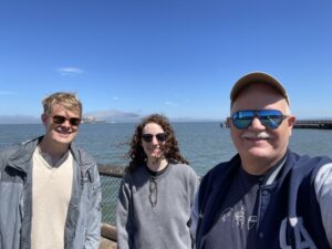 Ken Bigler, Sarah Margolis-Greenbaum, and Ted Drake in San Francisco with Alcatraz in the background.
